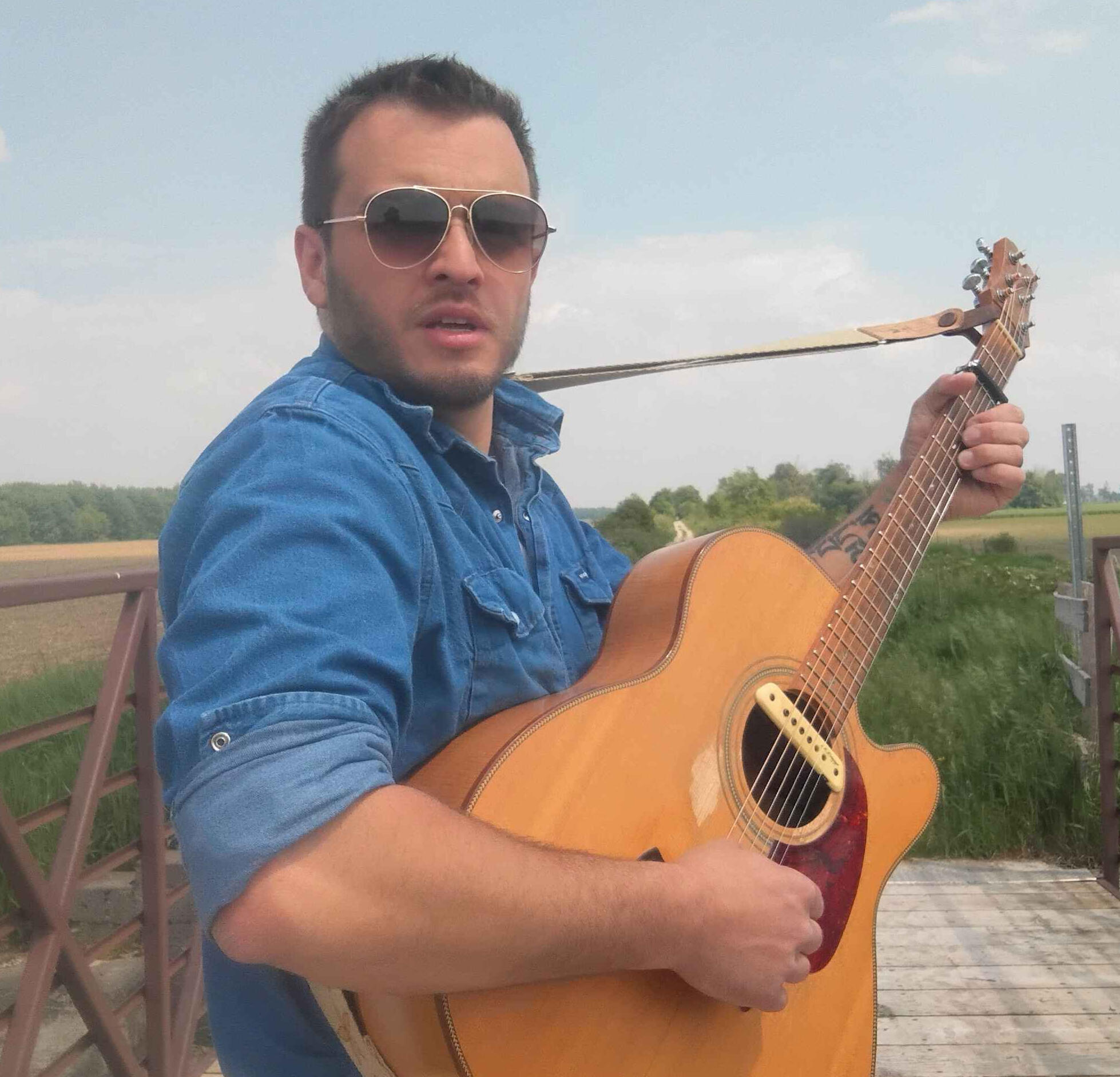Nick Vernem performing Reuben's Train live on acoustic guitar at an old rail trail bridge in Southwestern Ontario